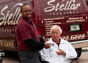 Stellar employee with wheelchair client.